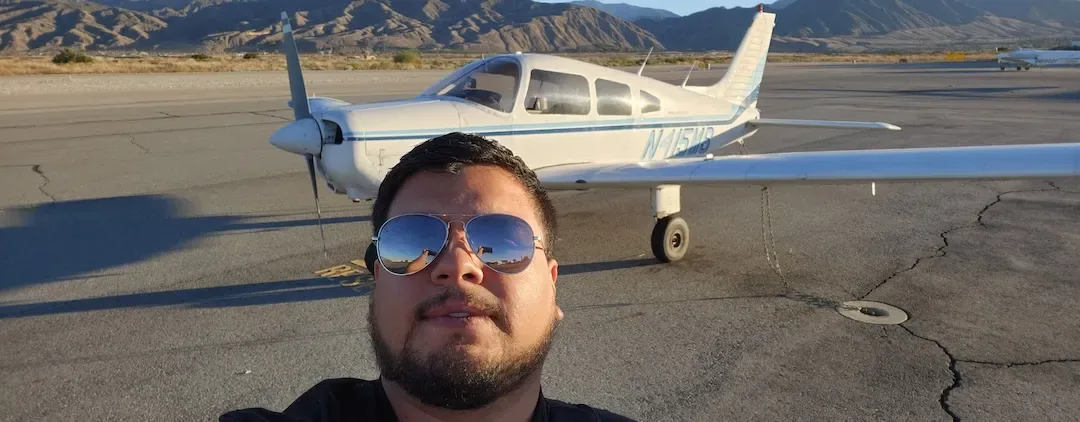A Piper Warrior low-wing training aircraft taxiing at Redlands Municipal Airport