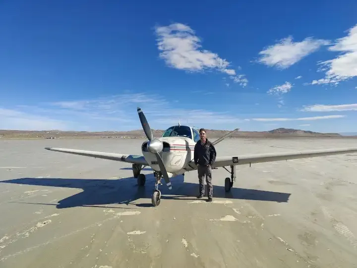 A training aircraft on a high-desert dry lake bed near the San Bernardino Mountains, used in Redlands-based training