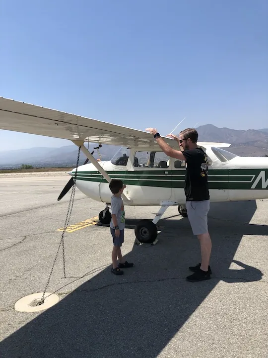 A father and son after a discovery flight at NextGen Flying Academy
